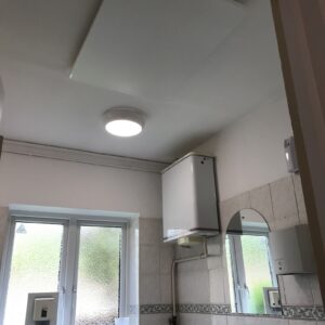 Village hall toilet heating with infrared panels